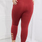 Yelete Ready For Action Full Size Ankle Cutout Active Leggings in Brick Red