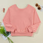 Bow Cutout Round Neck Long Sleeve Sweatshirt