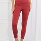 Yelete Ready For Action Full Size Ankle Cutout Active Leggings in Brick Red