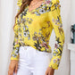 Ruffled Printed V-Neck Long Sleeve Blouse