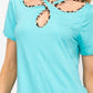 Celeste Full Size Crisscross Cutout Leopard Contrast Trim T-Shirt