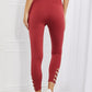 Yelete Ready For Action Full Size Ankle Cutout Active Leggings in Brick Red