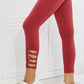 Yelete Ready For Action Full Size Ankle Cutout Active Leggings in Brick Red