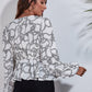 Ruched Printed V-Neck Long Sleeve Blouse